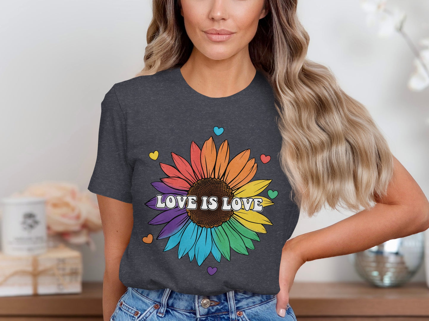Dark grey t-shirt with rainbow sunflower and "LOVE IS LOVE" text.