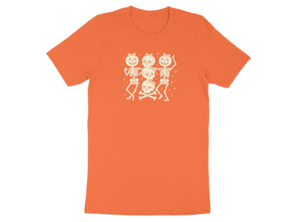 Orange t-shirt with a graphic of dancing skeletons and bow-adorned skulls.