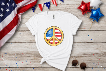 White t-shirt with a peace sign featuring the American flag design.