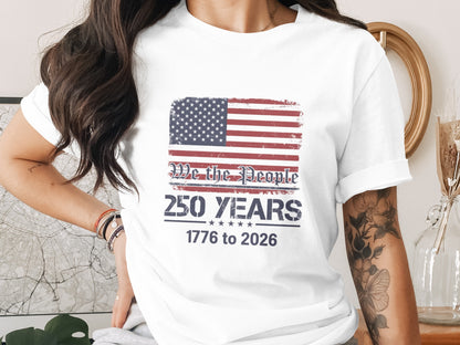 T-shirt with US flag and "We the People 250 Years 1776 to 2026" text.