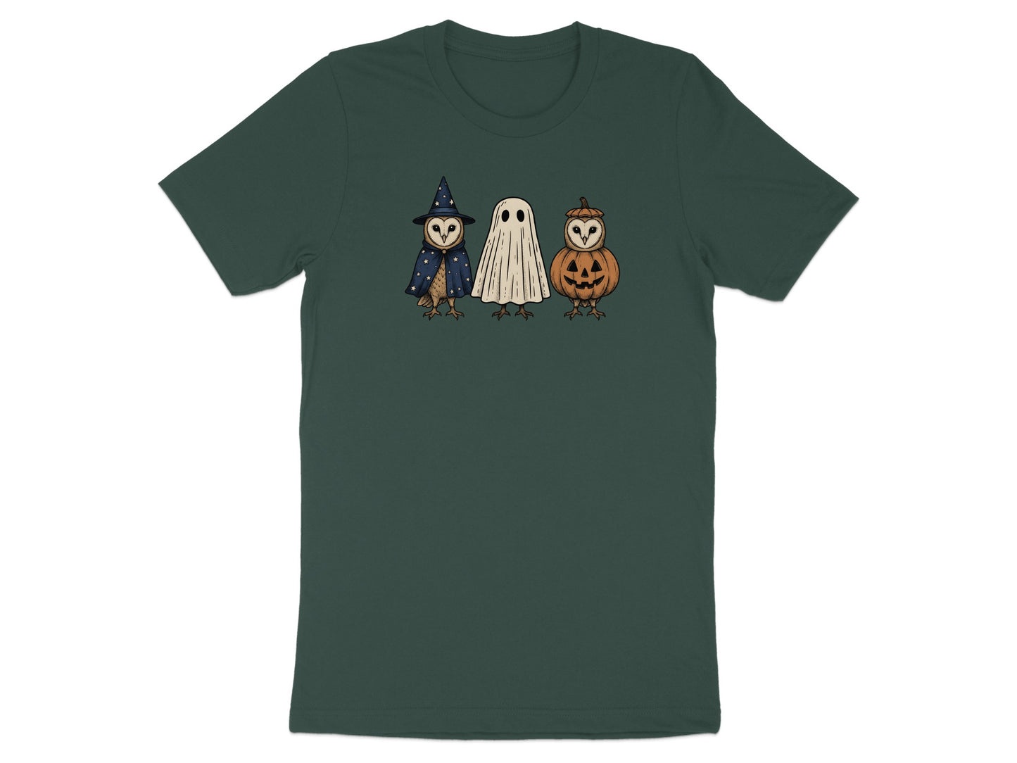 Three cartoon owls dressed as a witch, a ghost, and a jack-o'-lantern on a dark green t-shirt.