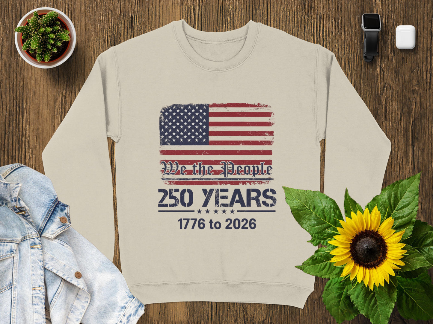 Crewneck sweatshirt with distressed American flag and text "We The People 1776 to 2026".