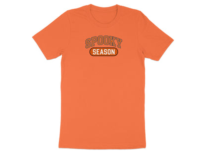 Orange t-shirt with "Spooky Season" graphic on chest.