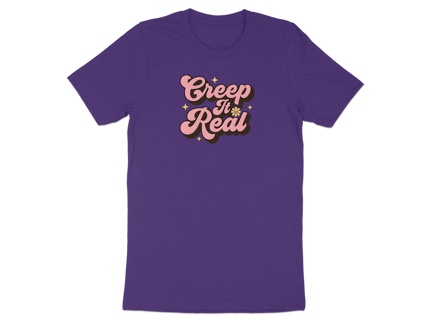 Purple t-shirt with "Creep It Real" text in pink and brown groovy font.