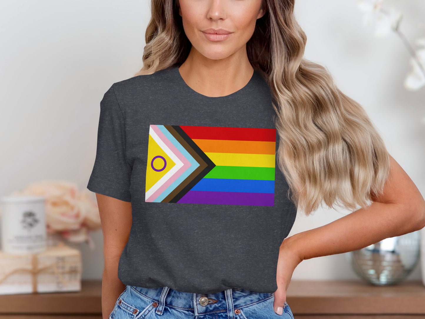 Dark grey t-shirt with progressive pride flag design.