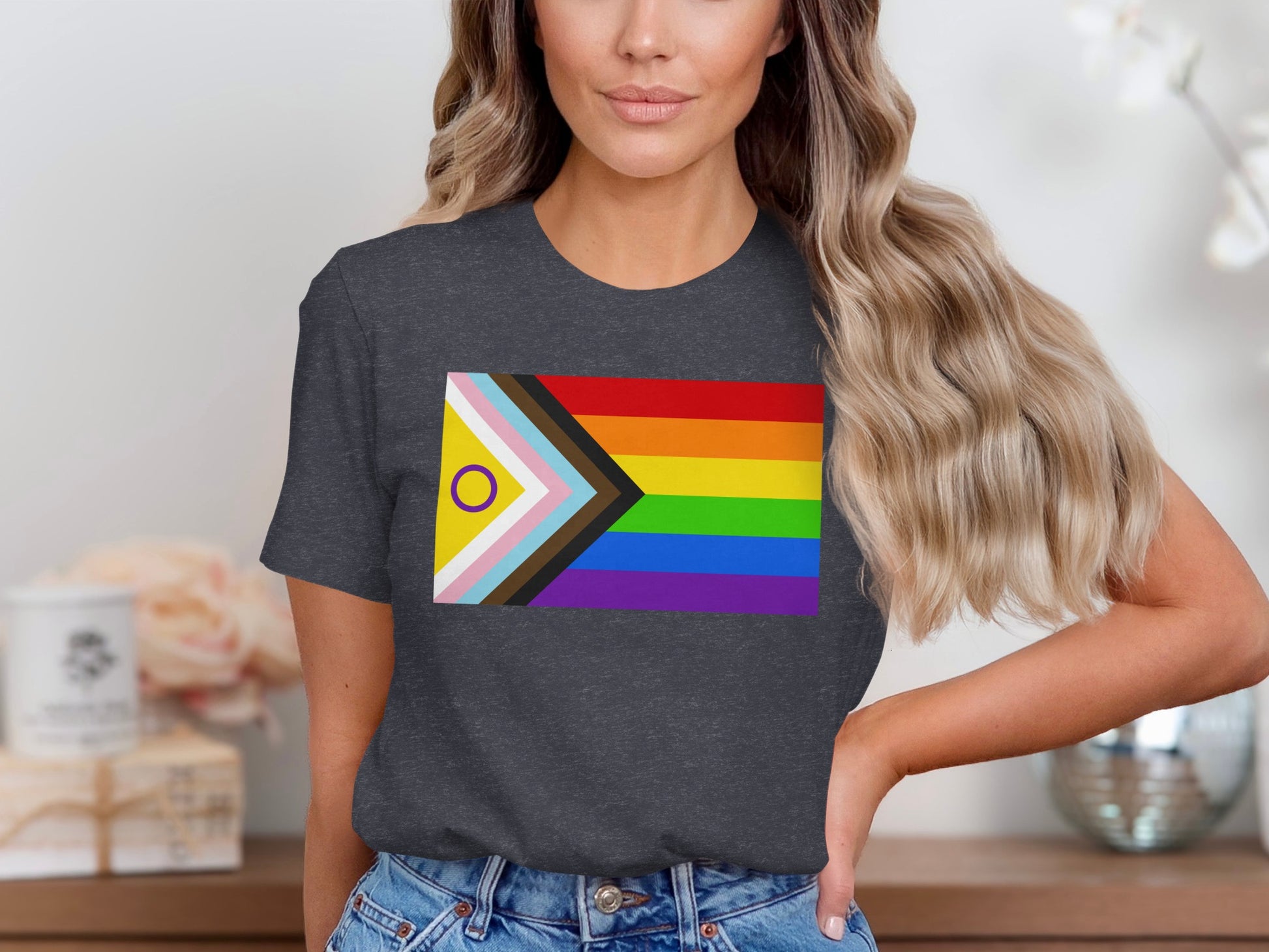 Dark grey t-shirt with progressive pride flag design.