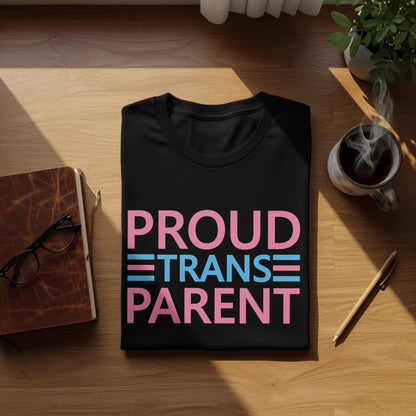 Black t-shirt with "PROUD TRANS PARENT" text in pink and blue stripes.