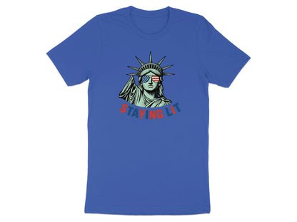 Statue of Liberty wearing sunglasses with "STAYING LIT" text.