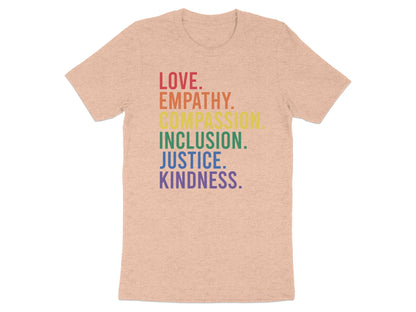 Peach t-shirt with rainbow text: Love, Empathy, Compassion, Inclusion, Justice, Kindness.