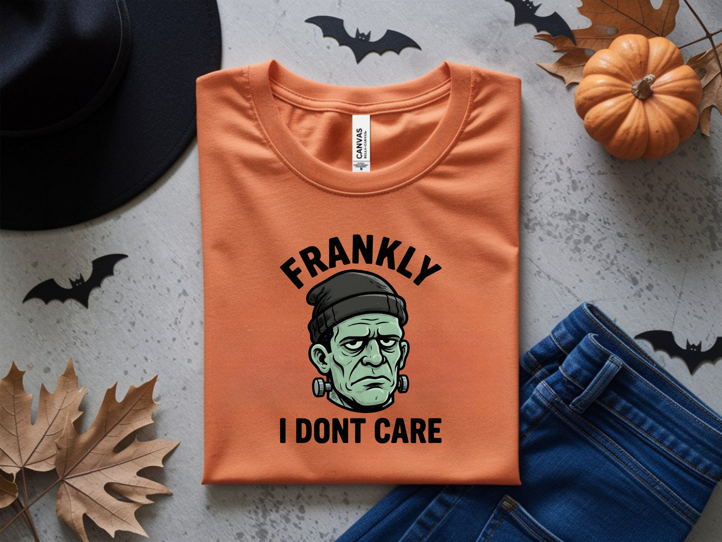 Orange t-shirt with a Frankenstein graphic and text "Frankly I Dont Care".