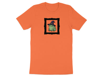 Orange t-shirt with a framed illustration of a frog wearing a witch hat.