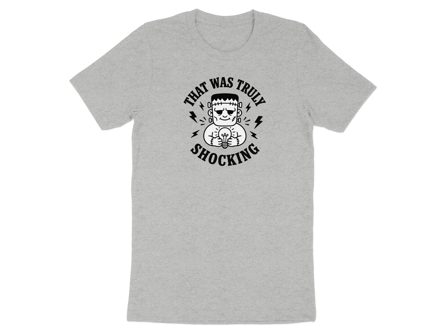 Grey t-shirt with Frankenstein character holding an incandescent bulb, text "THAT WAS TRULY SHOCKING".