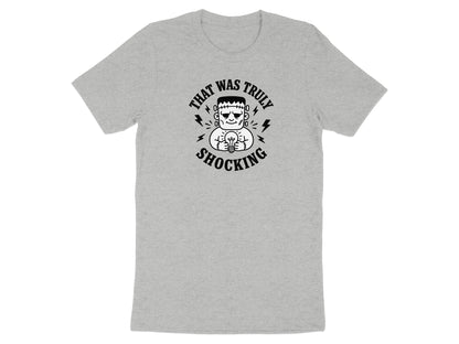 Grey t-shirt with Frankenstein character holding an incandescent bulb, text "THAT WAS TRULY SHOCKING".