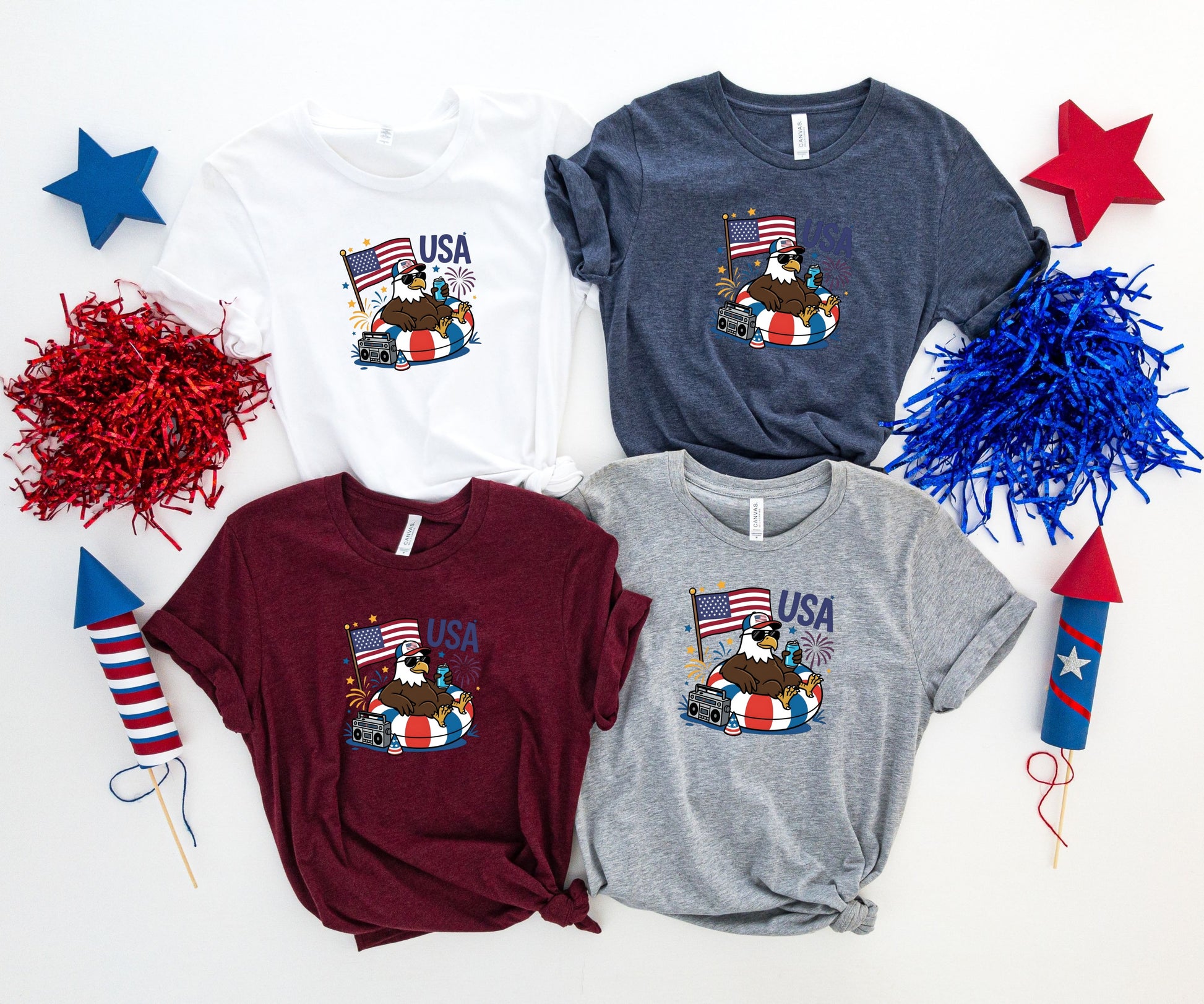 Four t-shirts featuring an eagle with sunglasses and headphones holding an American flag.