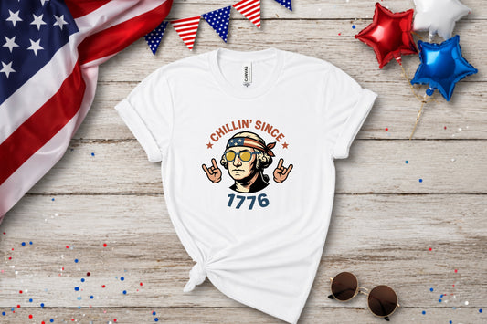 White t-shirt with "Chillin' Since 1776" text and patriotic graphic.