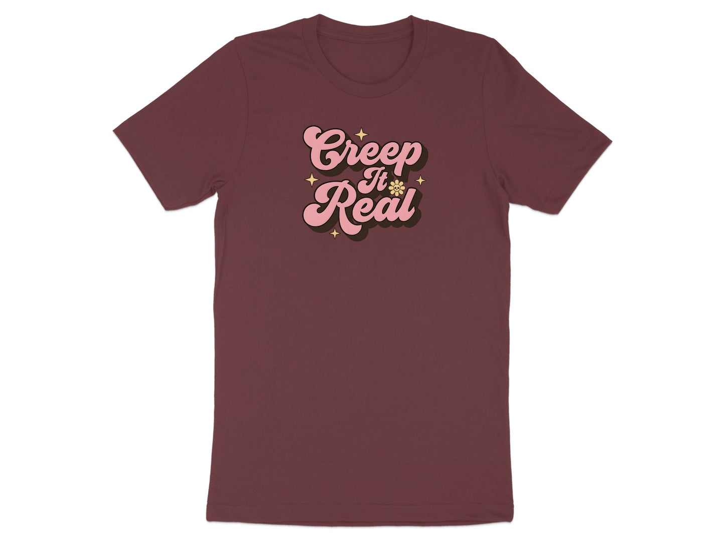 Maroon t-shirt with pink "Creep It Real" text and star graphics.