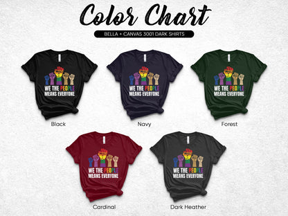 Five dark t-shirts in different colors showing a rainbow fist with "WE THE PEOPLE MEANS EVERYONE."