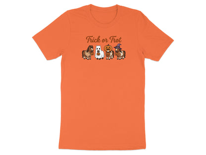 Orange t-shirt with cartoon horses in Halloween costumes and text "Trick or Trot".