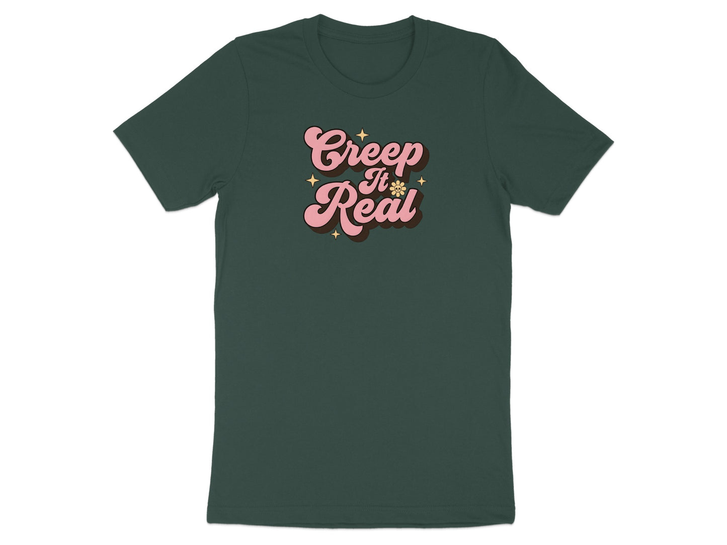 Dark green t-shirt with pink "Creep It Real" text and star design.