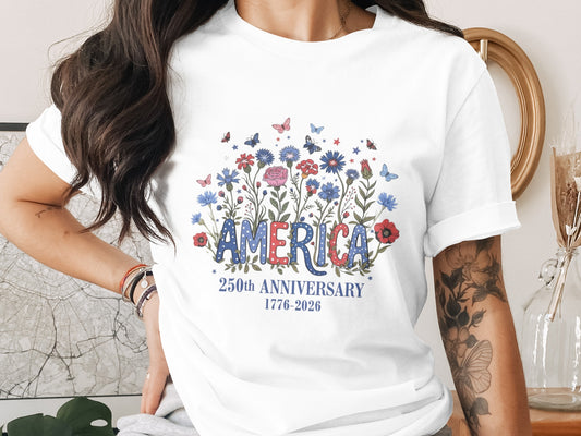 T-shirt with "America" in floral lettering, celebrating 250th anniversary.