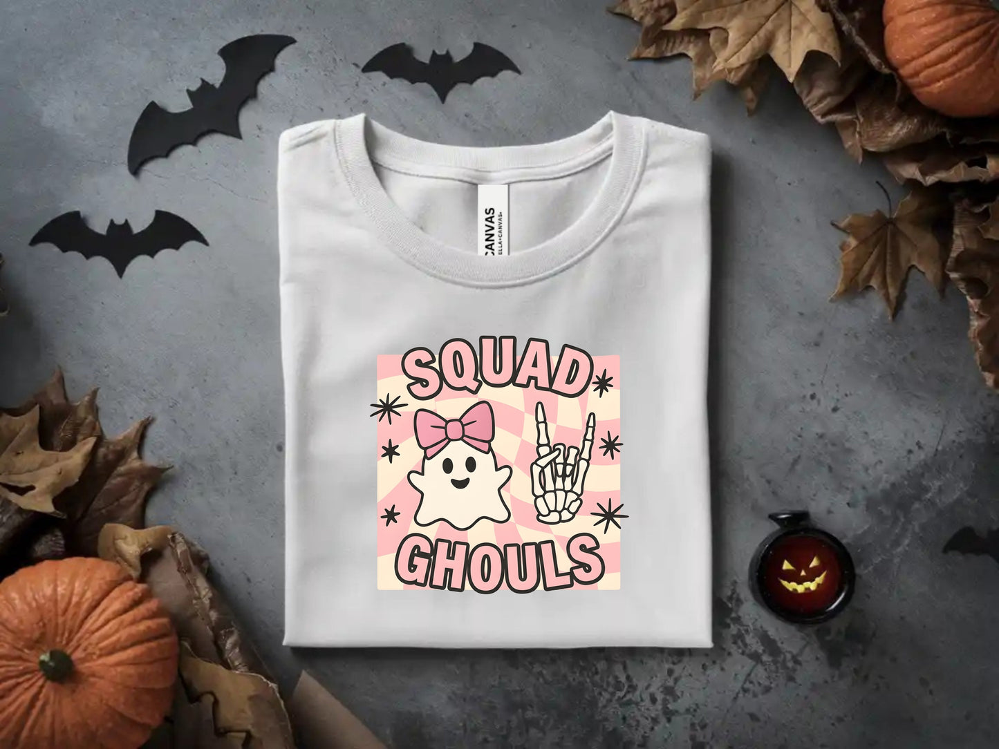 White t-shirt with "Squad Ghouls" graphic featuring a ghost and skeleton hand.