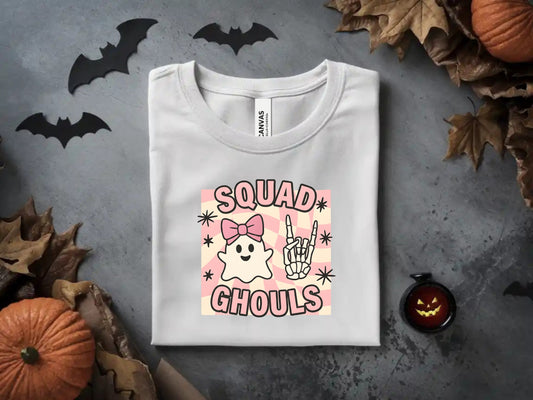 White t-shirt with "Squad Ghouls" graphic featuring a ghost and skeleton hand.