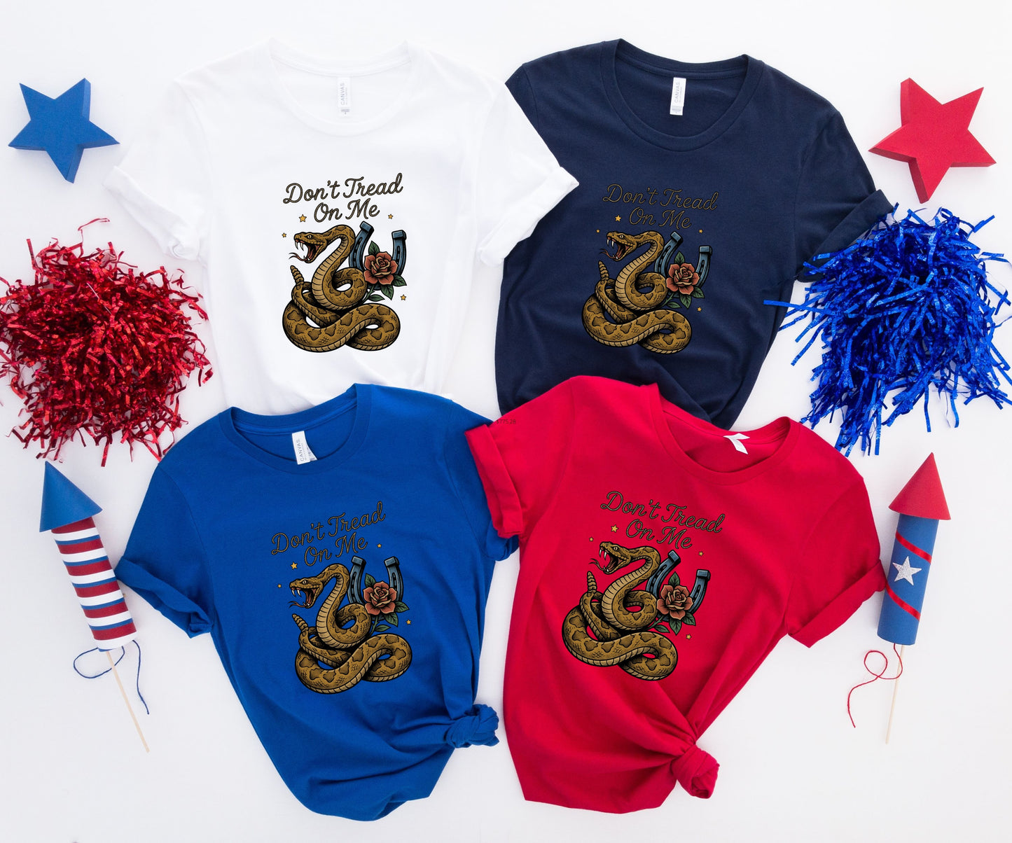 Four t-shirts in red, blue, white, and navy, each with "Don't Tread On Me" and a coiled snake graphic.