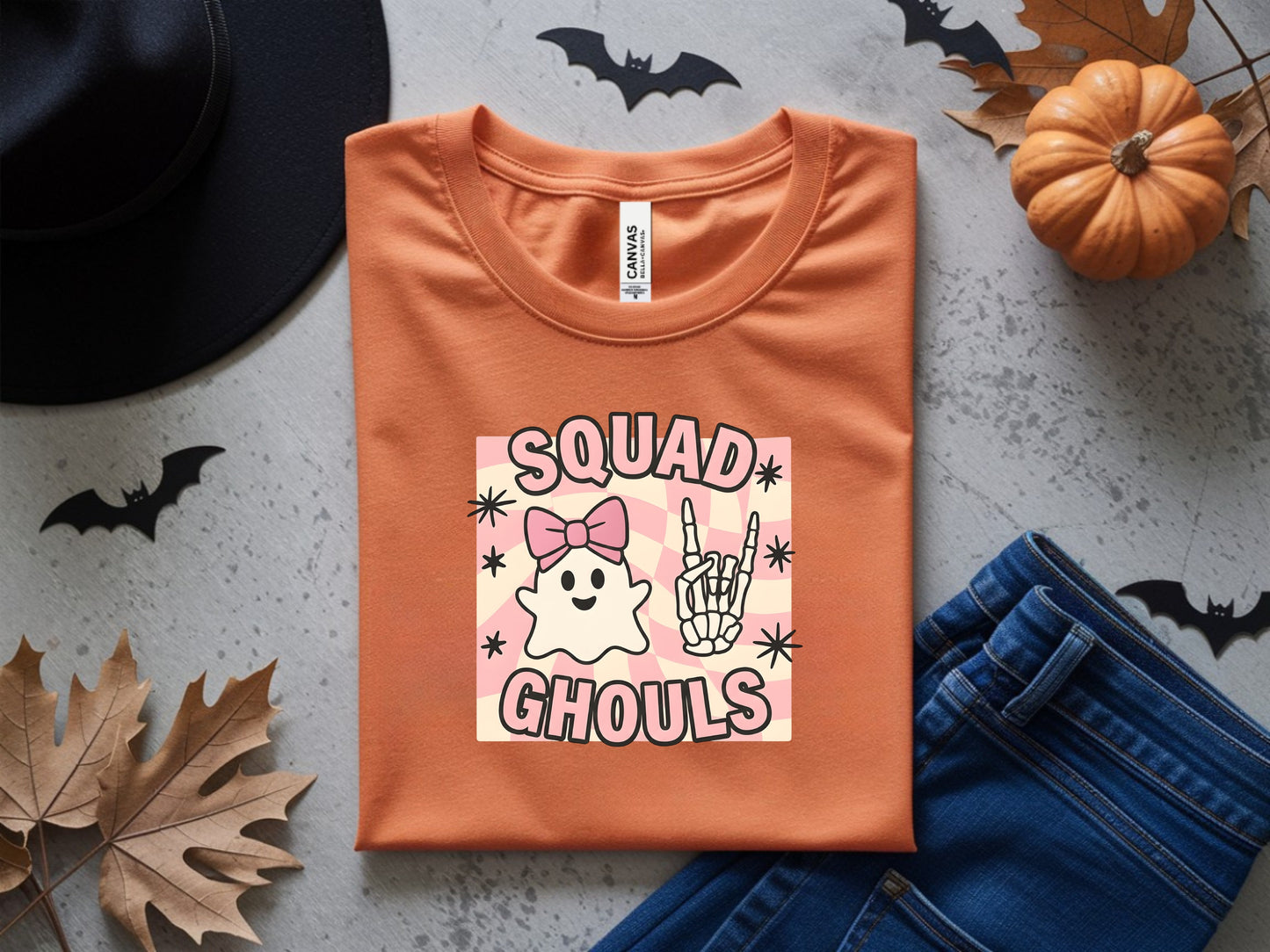 Orange t-shirt with "Squad Ghouls" graphic featuring ghosts and skeleton hand.