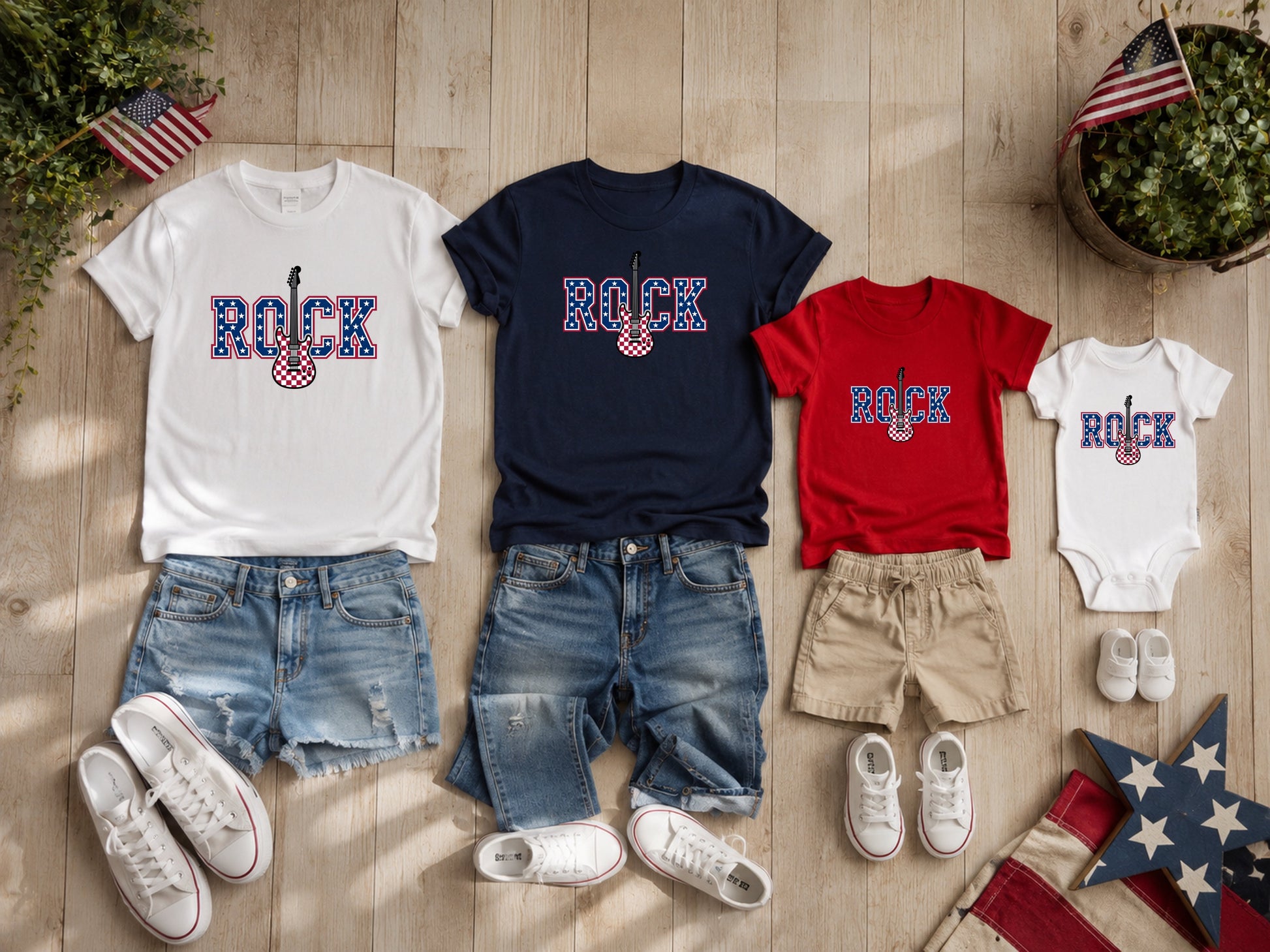 Matching rock graphic t-shirts and onesie with denim shorts.