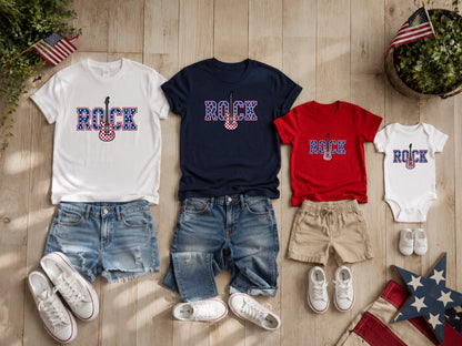 Matching rock graphic t-shirts and onesie with denim shorts.