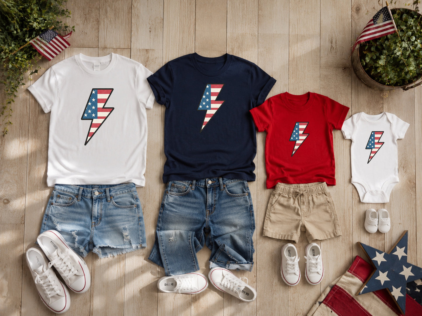 Children's patriotic lightning bolt t-shirts and onesie with denim shorts.