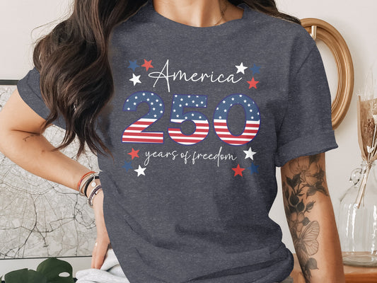 Dark gray t-shirt with "America 250 years of freedom" in patriotic stars and stripes design.