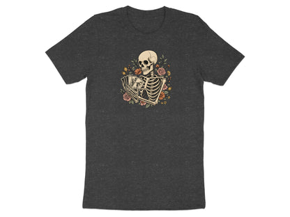 Skeleton holding tarot cards with flowers on a dark grey t-shirt.