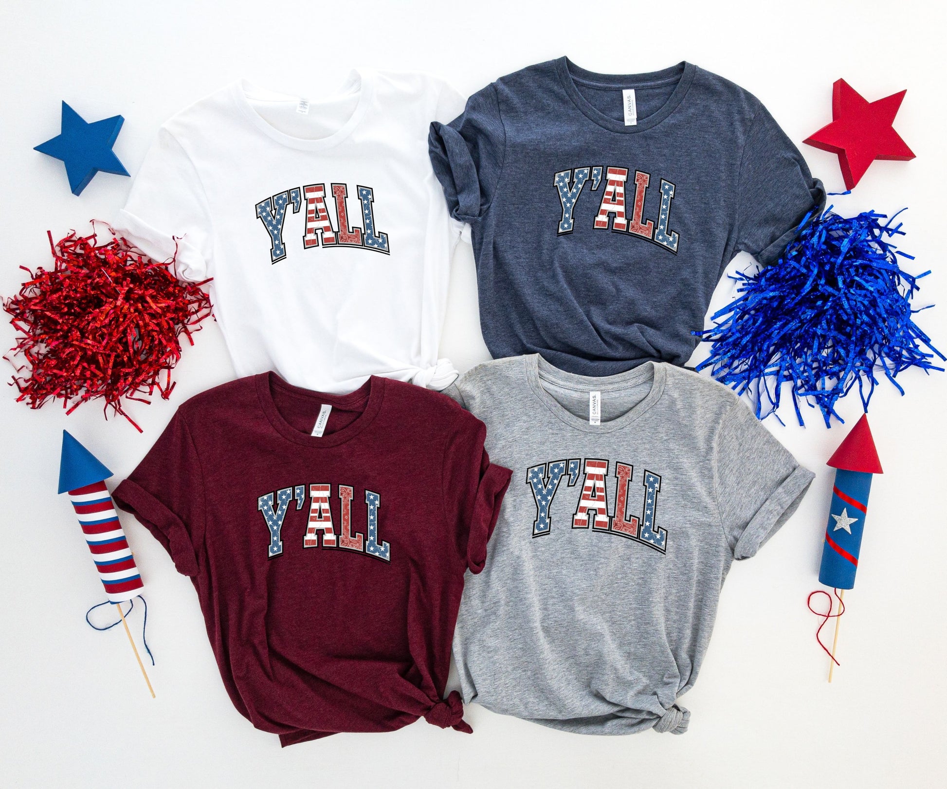 Four t-shirts with "Y'all" in a patriotic star and stripe design.