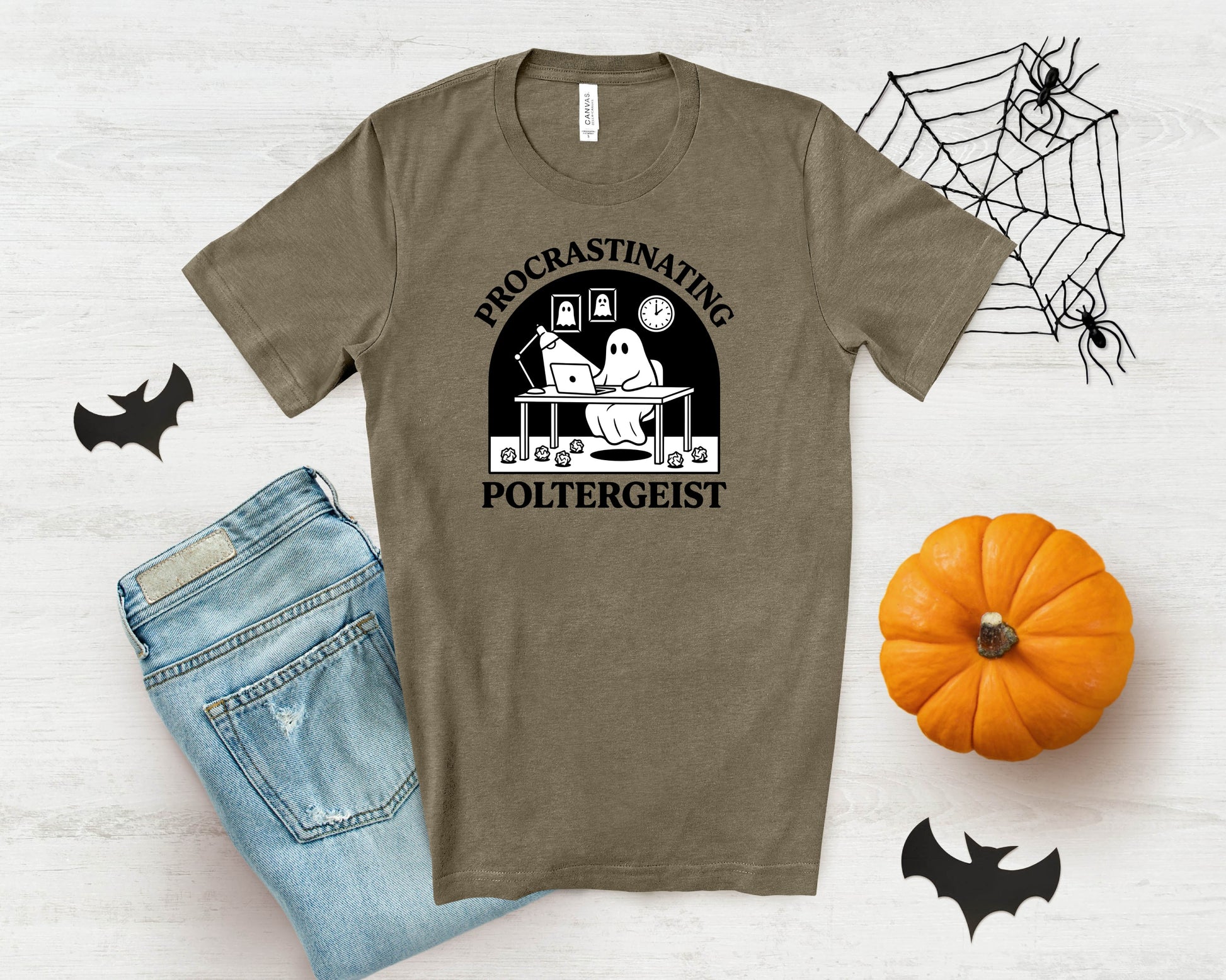 T-shirt with a ghost at a desk under the words "Procrastinating Poltergeist".