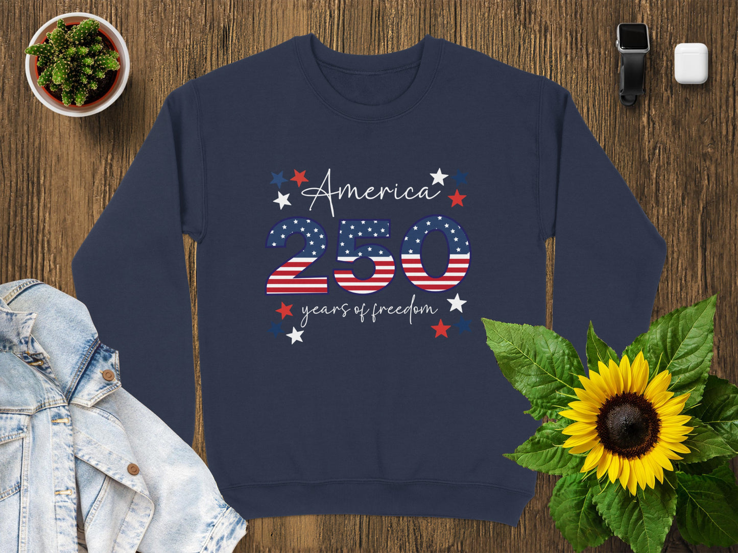 Navy sweatshirt with "America 250 Years of Freedom" text and stars.