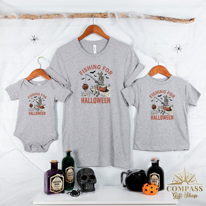 Three grey t-shirts display skeleton fishing for Halloween with bats and pumpkins.