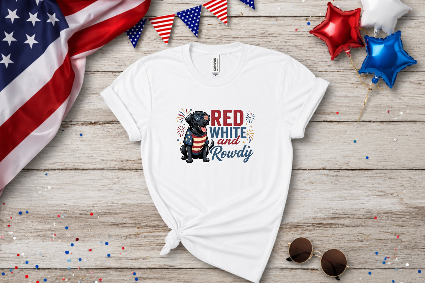 White t-shirt with black dog wearing sunglasses and American flag bandana, text "Red White and Rowdy".