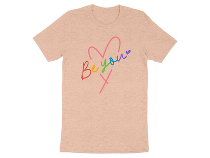 Peach t-shirt with "Be You" text and rainbow heart graphic.
