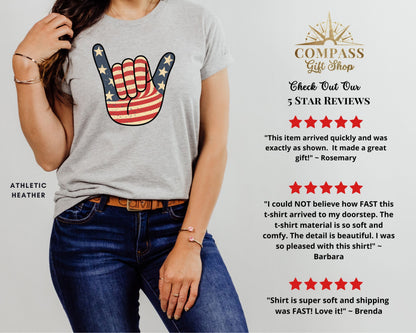 Gray t-shirt with American flag hand gesture and customer reviews.