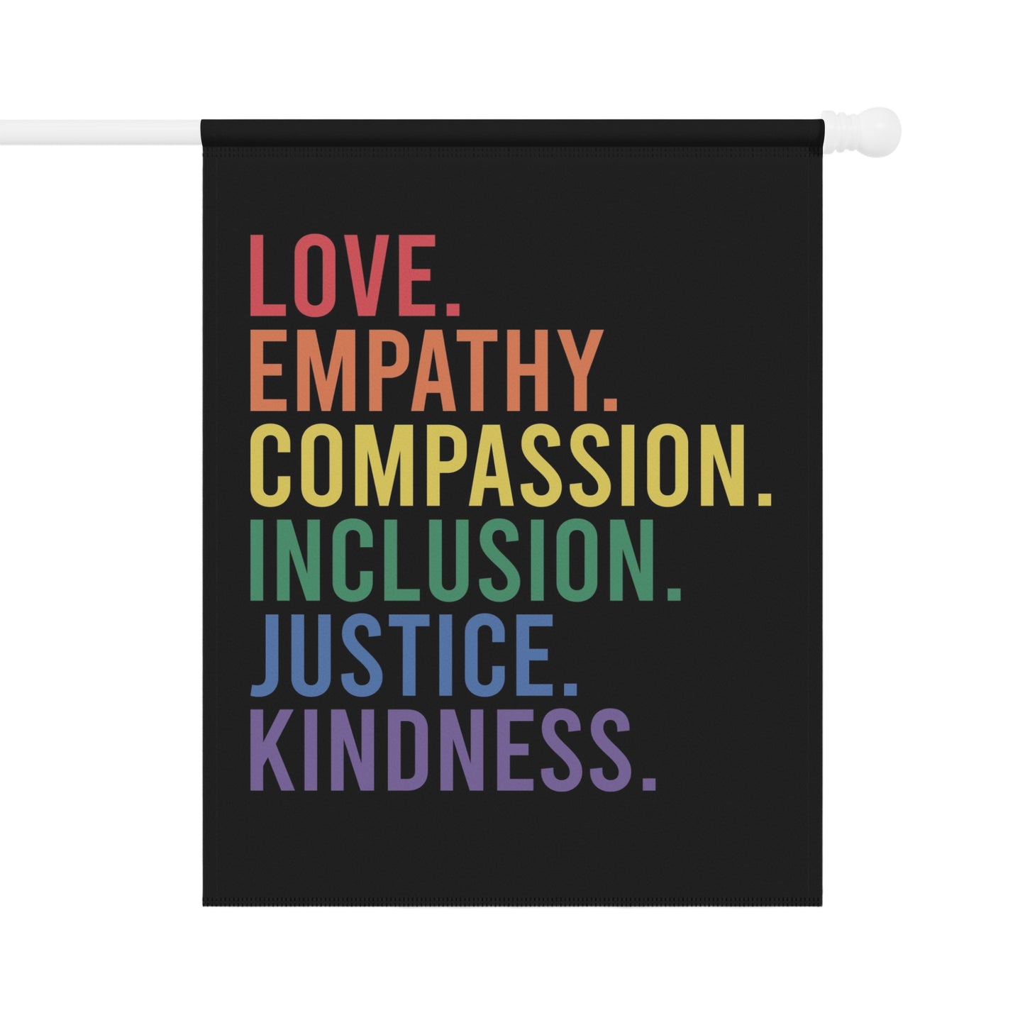 Black flag with colorful text: LOVE, EMPATHY, COMPASSION, INCLUSION, JUSTICE, KINDNESS.